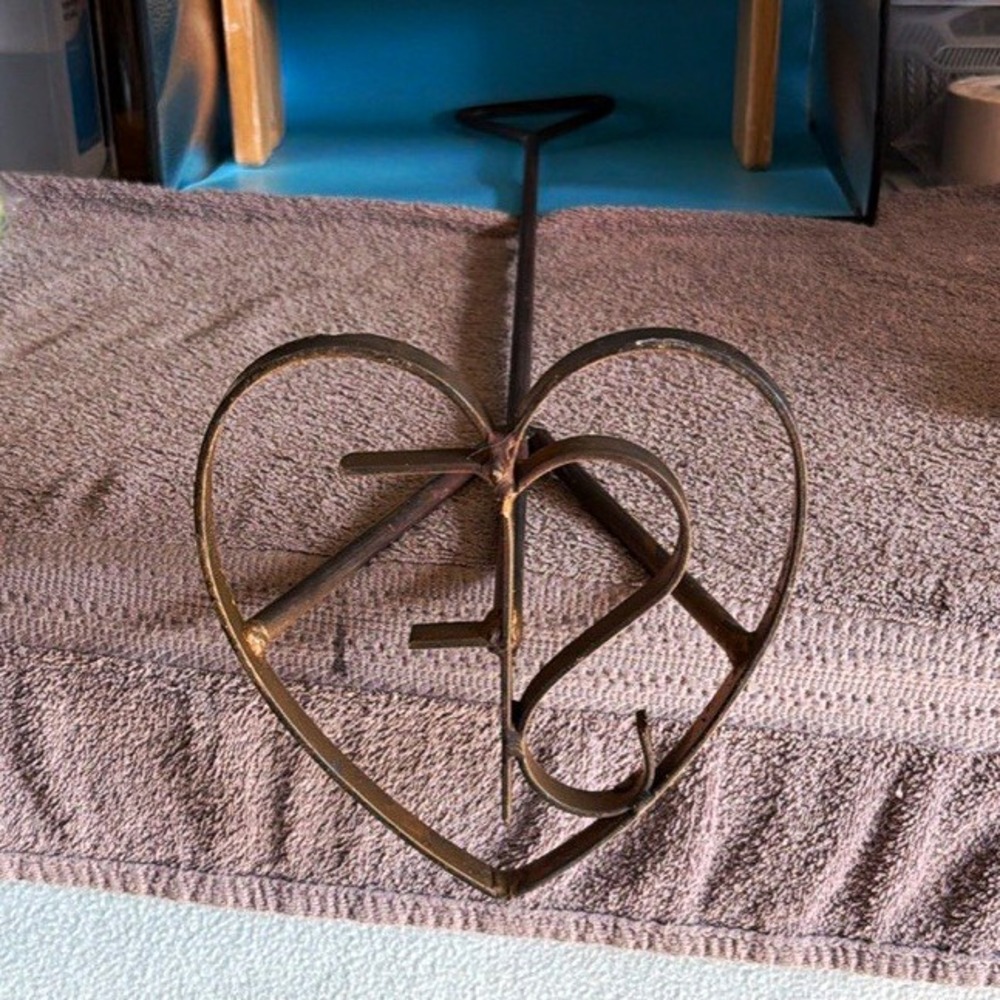 Vintage branding iron with a heart and initials S.F. Great rustic decor